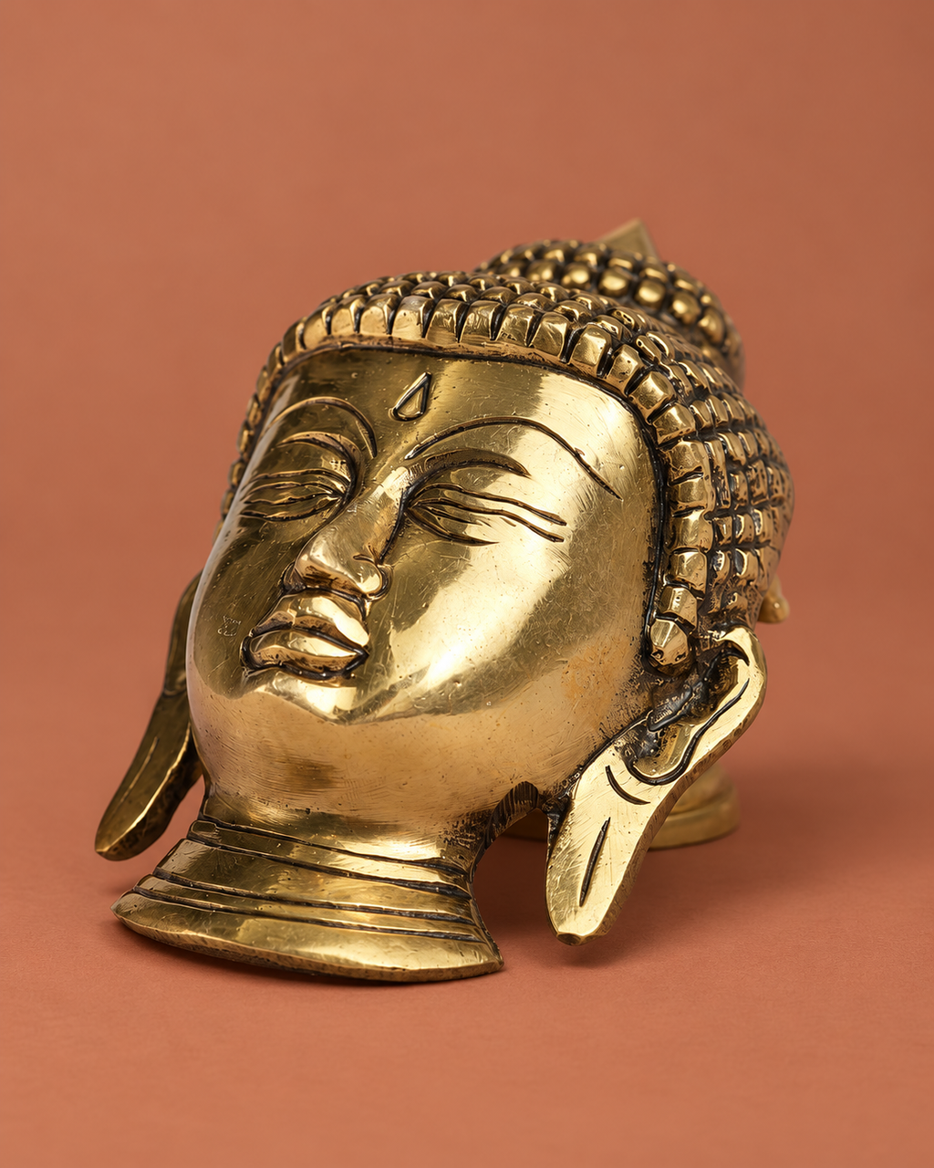 Brass Buddha Face Wall Hanging — Three-quarter hero