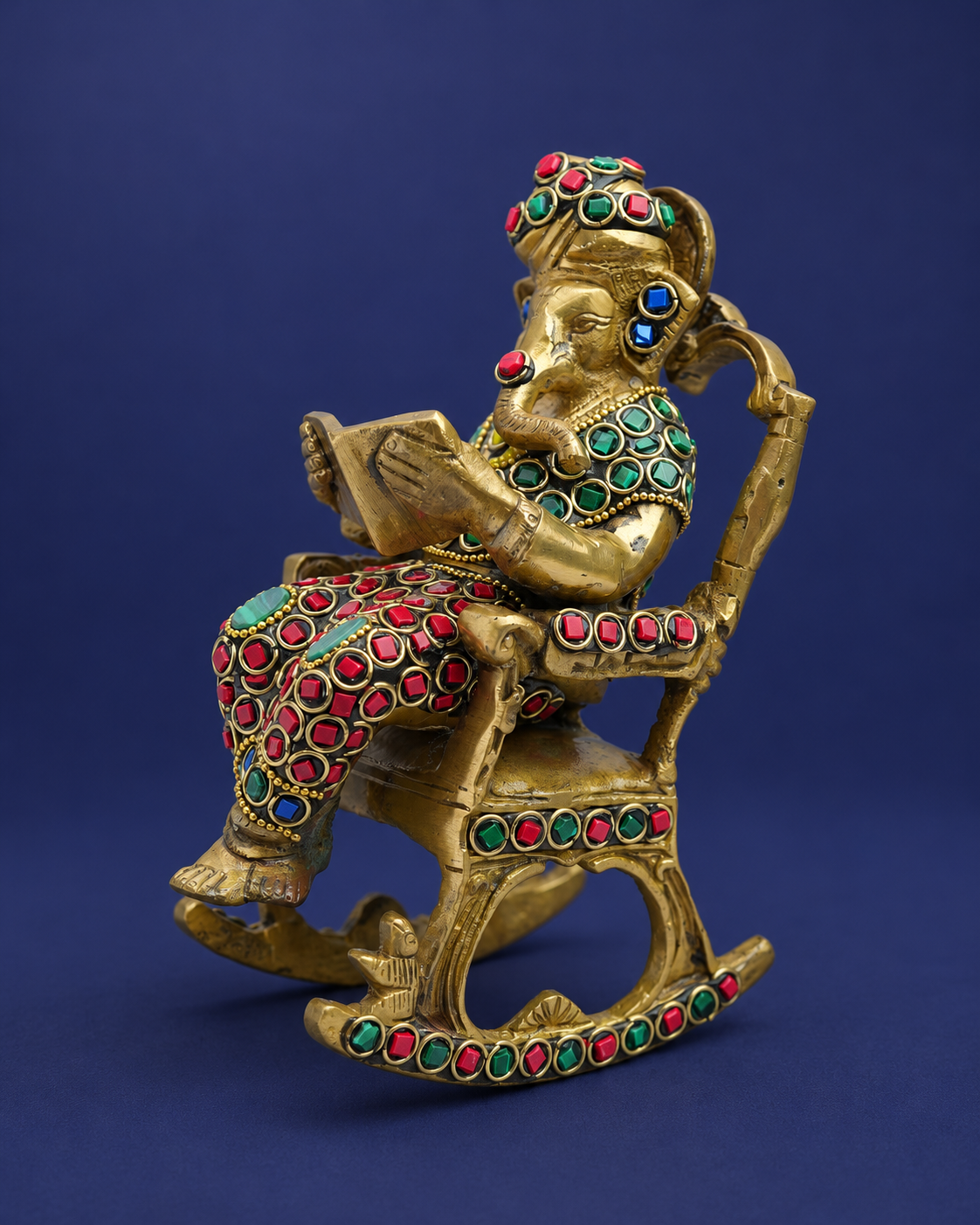 Brass Ganesha Reading on Recliner with Inlay Work — Three-quarter hero