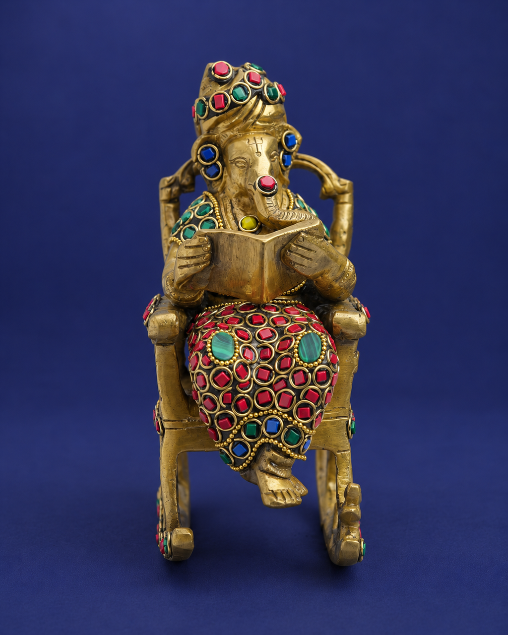 Brass Ganesha Reading on Recliner with Inlay Work — Front view