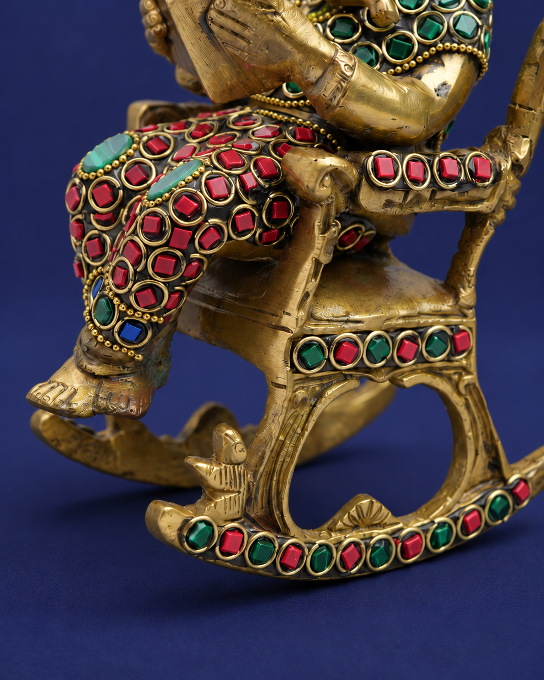 Brass Ganesha Reading on Recliner with Inlay Work — Finish detail