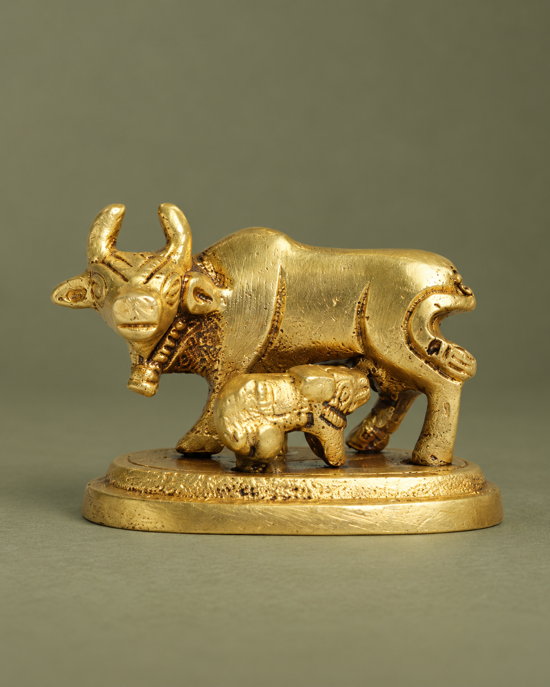 Brass Kamadhenu Cow with Calf Showpiece — Three-quarter hero